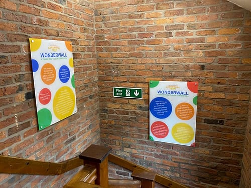 Modern acrylic reception sign welcoming visitors